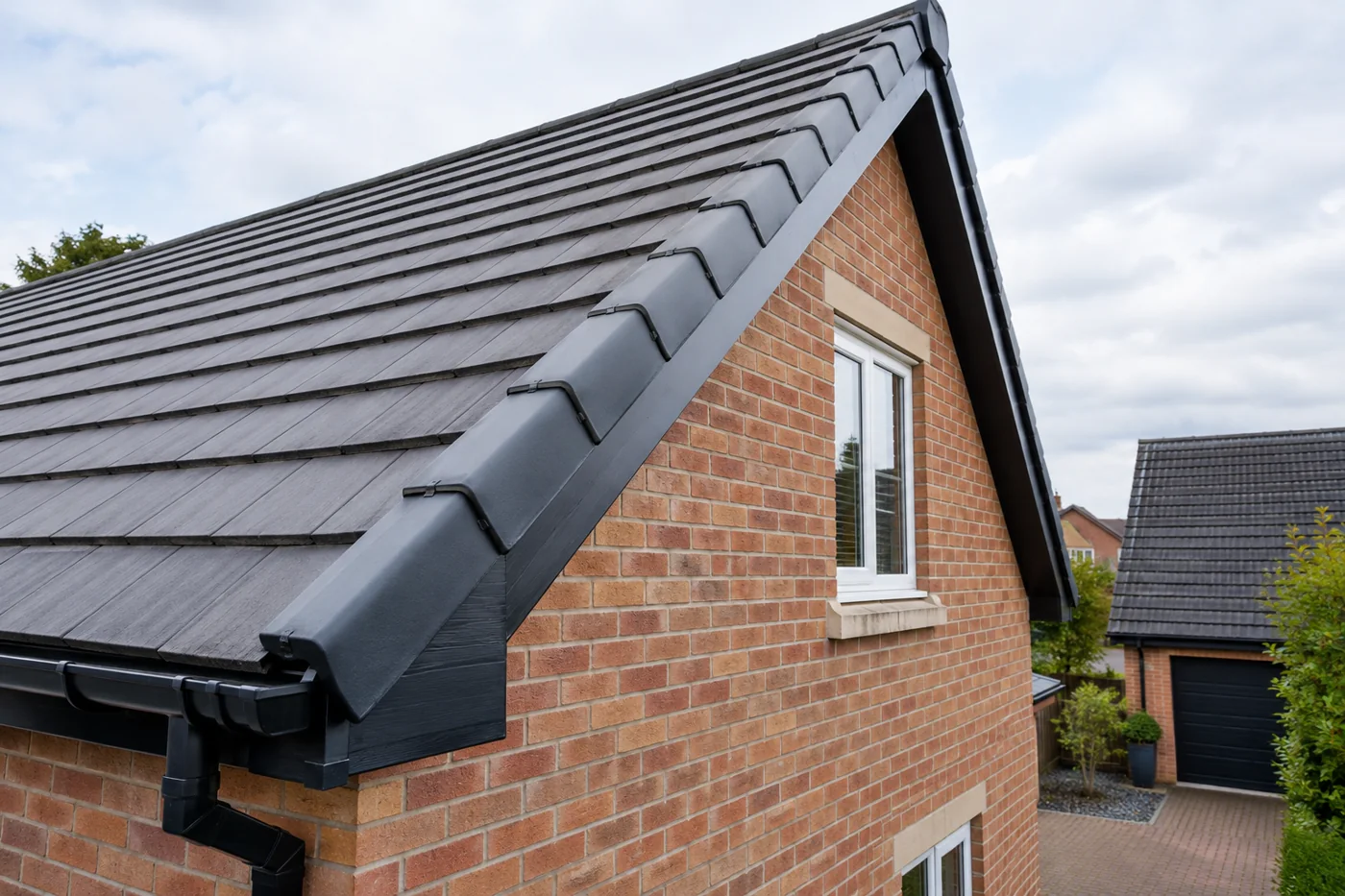 Pitched roof ridge or verge detail