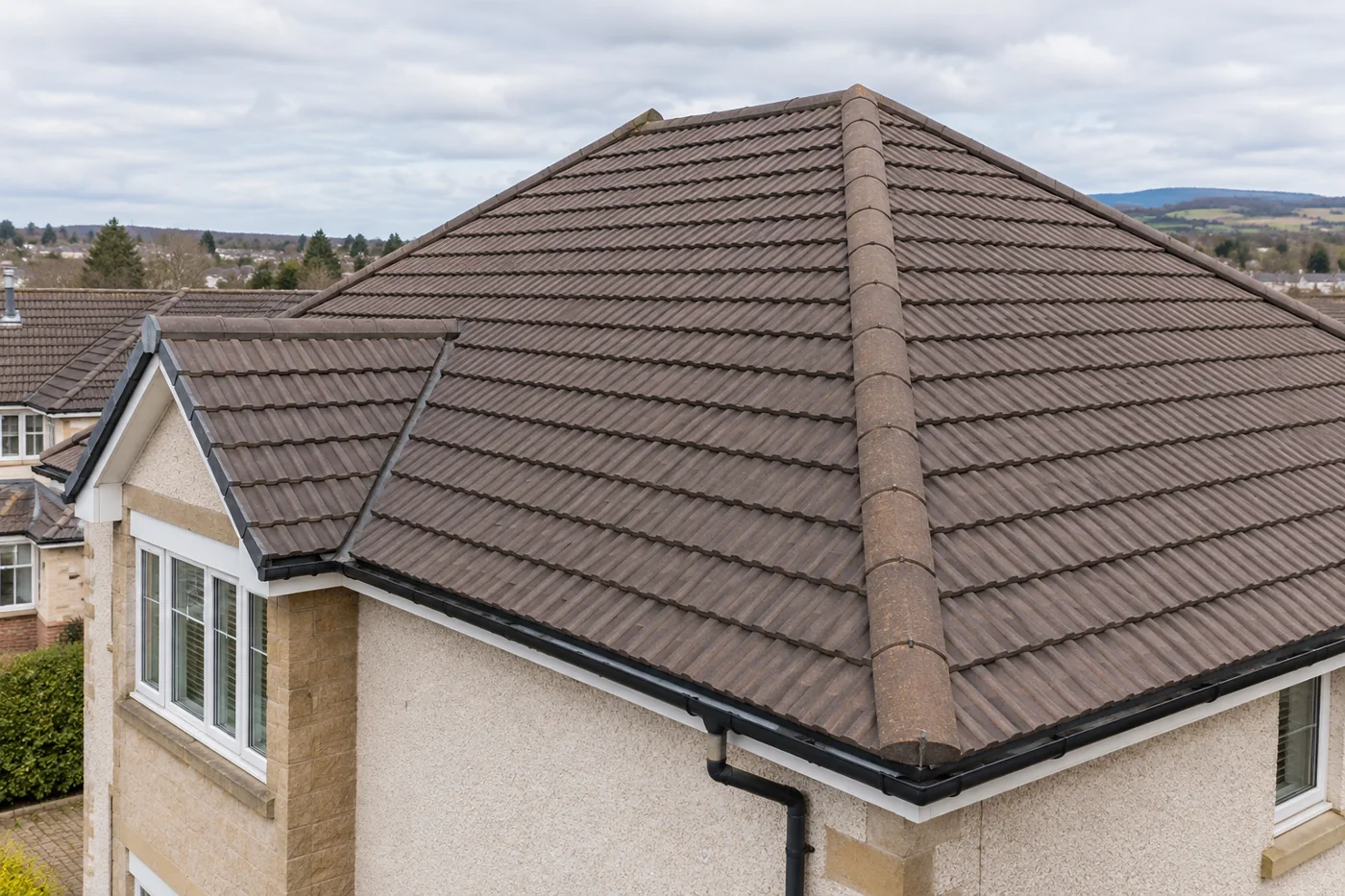 Interlocking tiled domestic roof and ridge